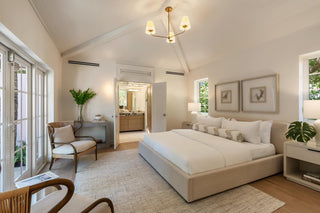 Turnkey Furniture Packages for purchase. Neatly arranged bedroom with a bed, chairs, and decor. All About the Wow